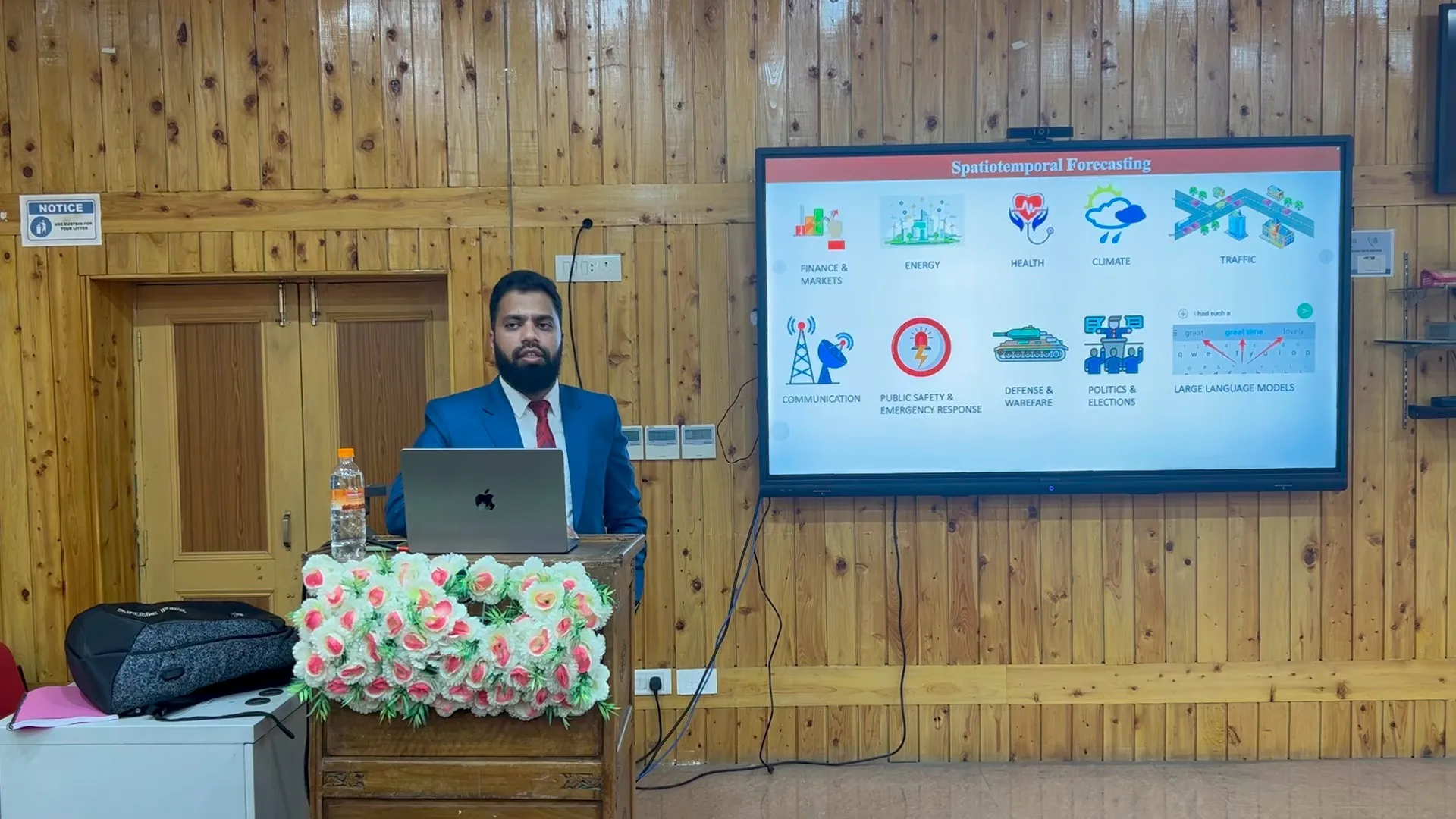 Junaid Farooq at the lectern presenting his PhD thesis